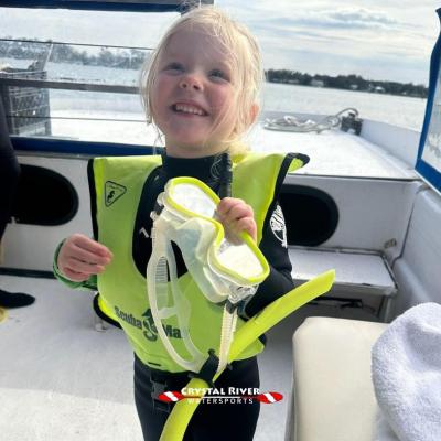 Little girl in scuba gear on a boat with Crystal River Watersports