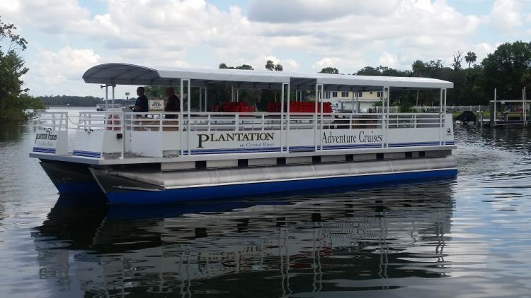 The Plantation on Crystal River Adventure Cruise boat on the water.