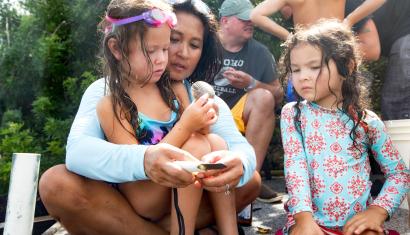 family scalloping on pier